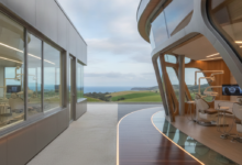 A photorealistic conceptual image showing a visual split between two distinct architectural styles, representing the contrast between public and private dental care systems. One side appears minimalist and functional, while the other is modern and technologically advanced, all set against a softly blurred, distant New Zealand landscape.